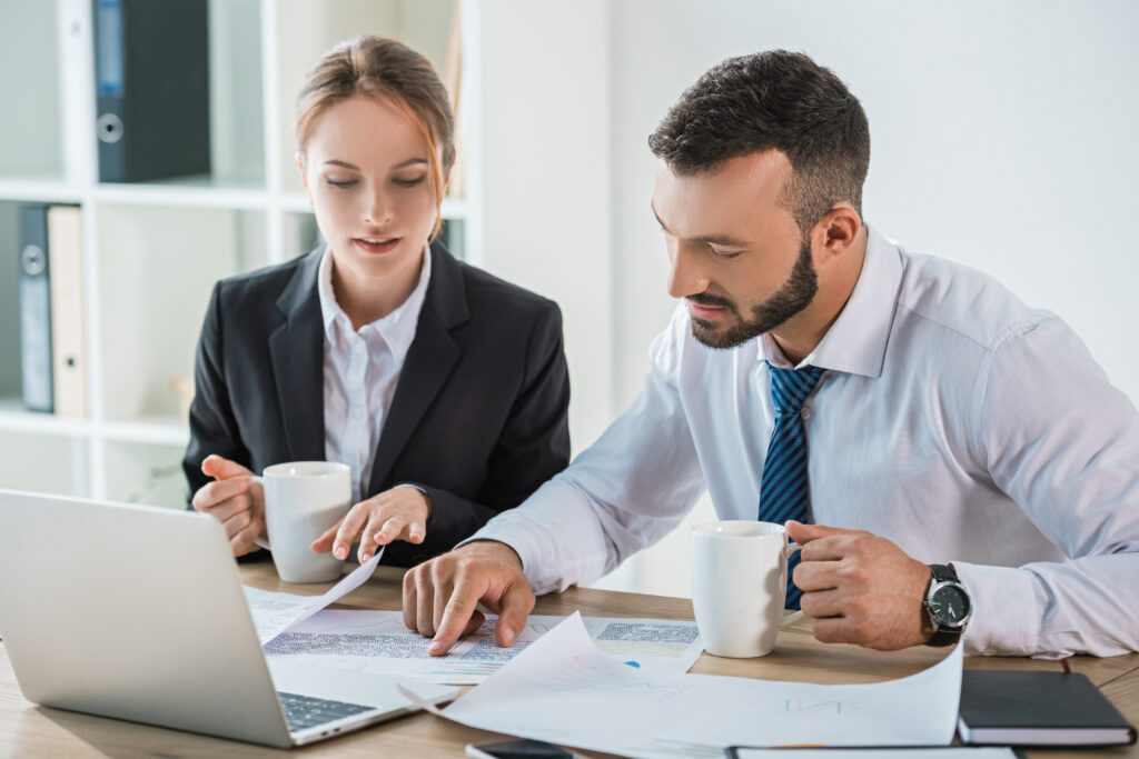 Small business owner reviewing managed IT support pricing at a desk in Jacksonville FL