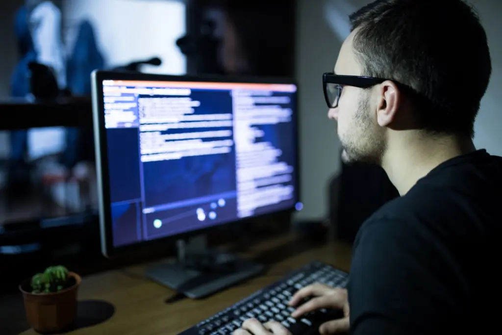 Business owner responding to a suspected cyberattack on an office computer