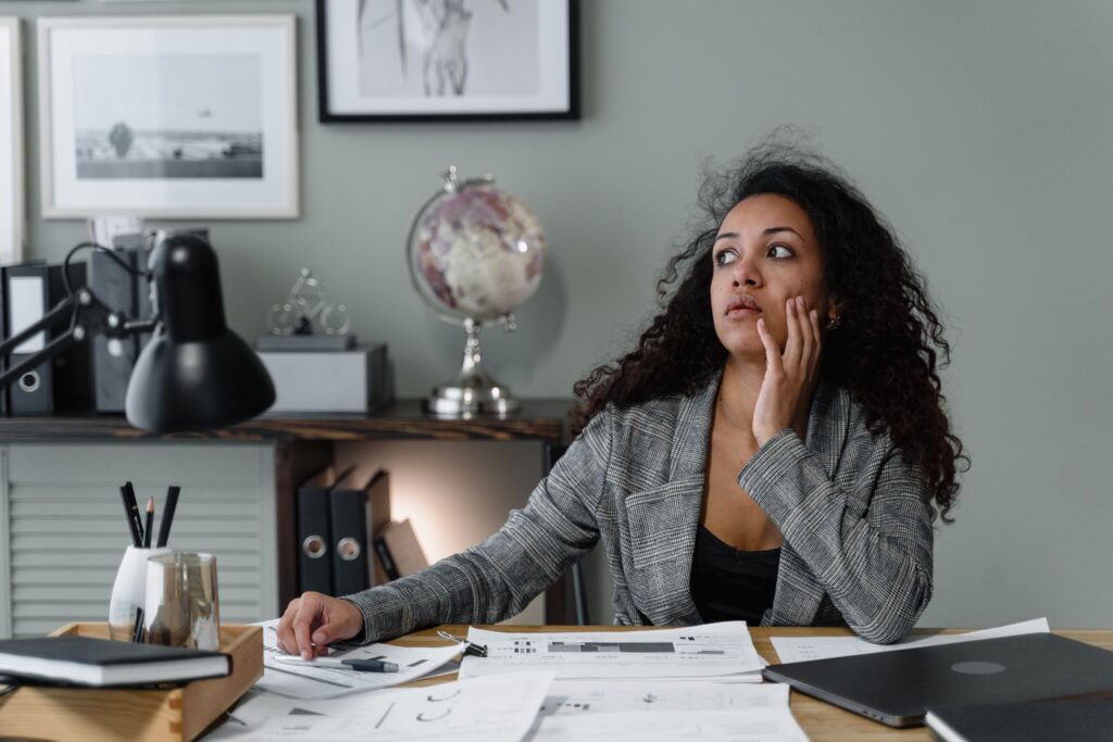 Business owner reviewing a suspicious invoice email on a laptop